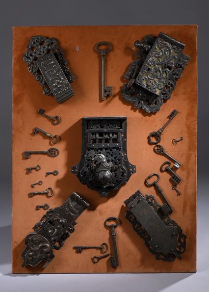 null Lot composed of five locks with scrolls and foliage decoration and eighteen...