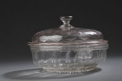 null Transparent glass compotier; lid blown in a mold with facets decoration

18th...