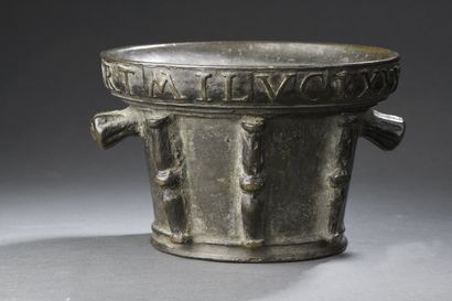 null Large bronze mortar with two fluted grips, six double baluster buttresses, inscription...