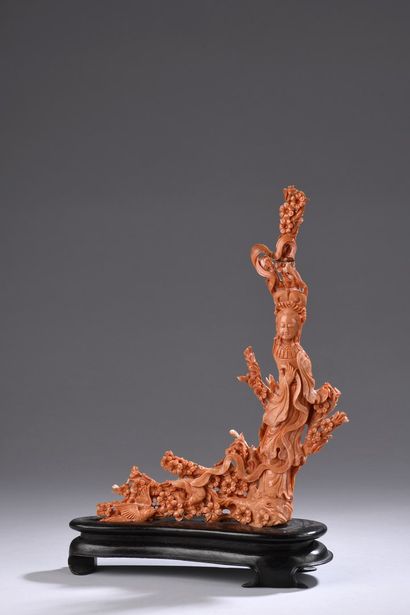 null CHINA - 20th century

Red coral group carved with a young woman standing on...