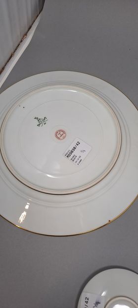 null SEVRES 
Four white porcelain pieces with gold decoration:
- a porcelain dinner...