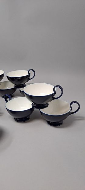 null SEVRES 
Twelve tea cups on pedestal in blue porcelain. 
Pieces said of waste,...