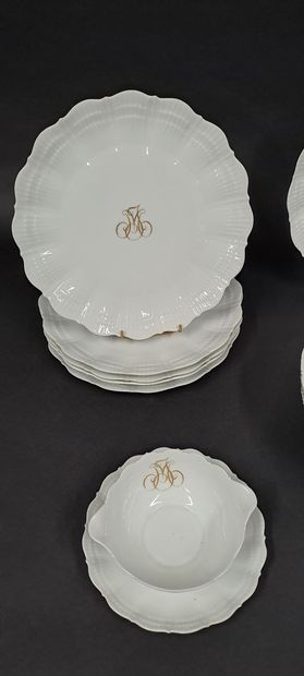 null Part of table service out of white porcelain with moved decoration, the parts...