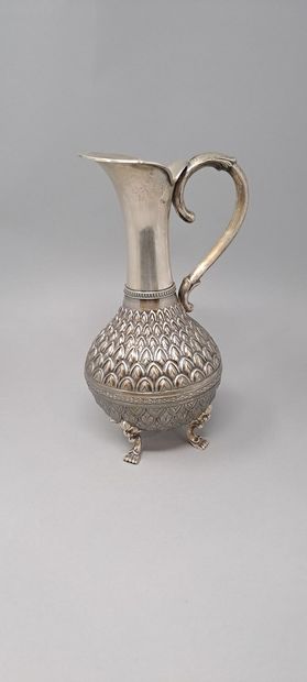 null Four-legged silver jug, the body with pineapple decoration, the feet with leafy...