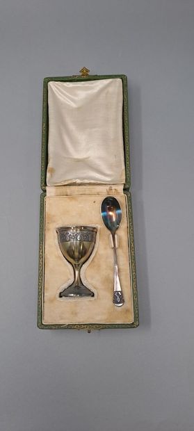 null Egg cup and its silver spoon decorated with a leafy frieze. 
In their case....