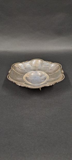 null Silver bowl resting on three feet with leafy attachments, scalloped and twisted...