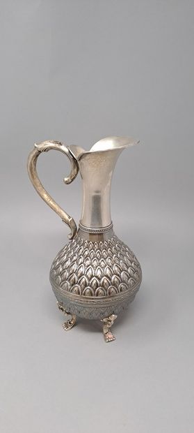 null Four-legged silver jug, the body with pineapple decoration, the feet with leafy...