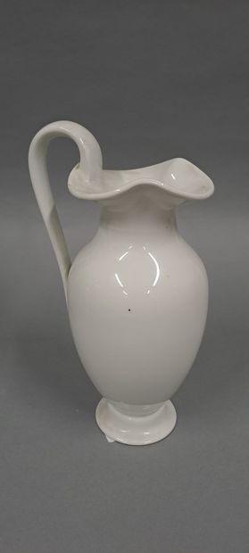null SEVRES 
Two jugs on pedestal in white porcelain, the neck polylobed. Pieces...