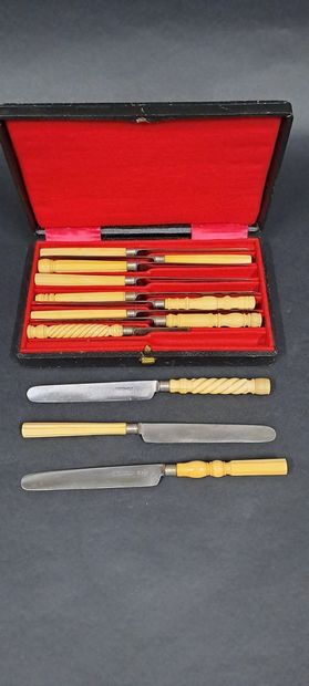 null Lot of cutlery including : 
12 table knives with turned ivory handles, probably...