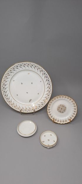 null SEVRES 
Four white porcelain pieces with gold decoration:
- a porcelain dinner...
