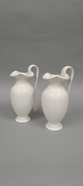 null SEVRES 
Two jugs on pedestal in white porcelain, the neck polylobed. Pieces...