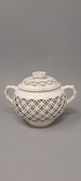 null SEVRES 
Part of tea service in white porcelain reticulated whose handle simulates...