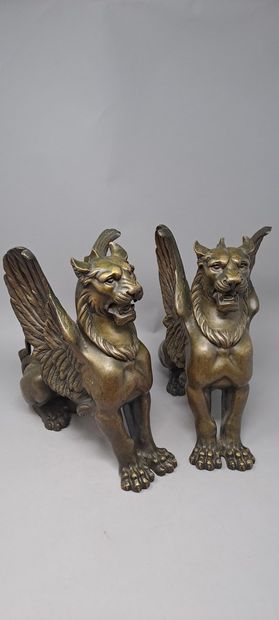 null Pair of sculptures in bronze with medal patina representing two winged lions.
19th...