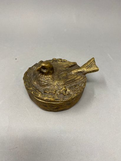 null A bombonniere in the shape of a bird in a nest 
Gilded bronze 
5 x 9.5 cm in...