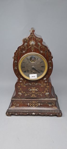 null Wooden clock with rich decoration of flowers and interlacing in mother-of-pearl...