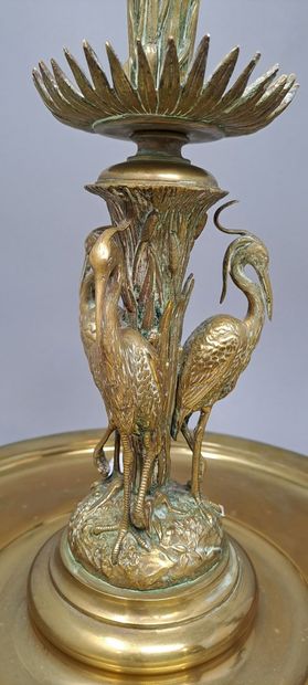 null Pair of gilt metal candlesticks decorated with storks and reeds.
End of the...