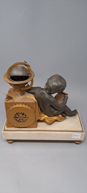 null Small clock with a child astronomer in chased, patinated and gilded bronze....