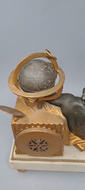 null Small clock with a child astronomer in chased, patinated and gilded bronze....