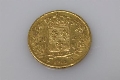 null Gold coin of 20 Francs Louis XVIII (1818 A)
Weight : 6,44 g.