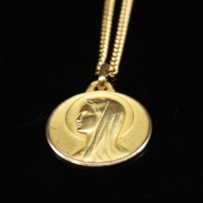 Chain and its medal in yellow gold 18k (750)...