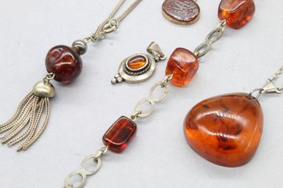 null Lot of amber and resin jewelry including necklace, bracelets and pendants. The...