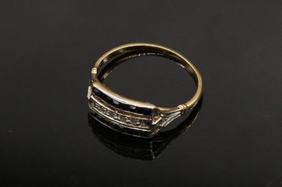 null Ring in 18k (750) yellow gold paved with a line of diamonds between two lines...