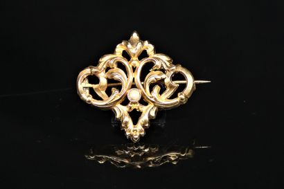 Brooch in 18k (750) yellow gold decorated...