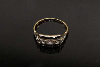 null Ring in 18k (750) yellow gold paved with a line of diamonds between two lines...