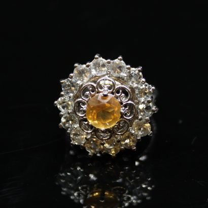 null Silver ring 925° centered of a round smoked topaz in a surround of round topazes....