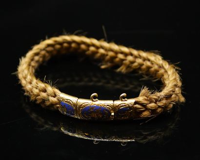 Bracelet of braided hair. The clasp in 18k...