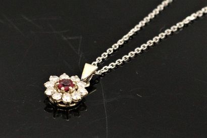 null 18k (750) white gold daisy chain and pendant set with a ruby in a diamond setting....