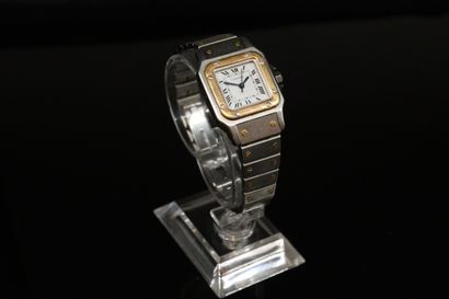 null 
CARTIER SANTOS CIRCA 1990

Gold and stainless steel ladies' wristwatch, screw-set...