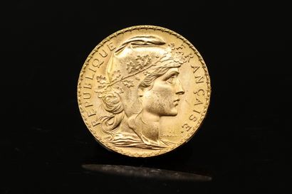 null Gold coin of 20 Francs with rooster (1909)

Weight : 6.45 g.