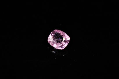 null Cushion pink spinel on paper. 

Weight : 1.52 ct.