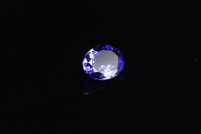 Oval Tanzanite on paper. 

Accompanied by...