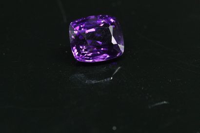 null Amethyst cushion on paper. 

Weight : 23.95 cts.