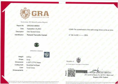 null Oval tsavorite garnet on paper. 

Accompanied by a GRA certificate attesting...