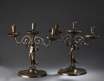 null Pair of bronze candlesticks with double branches. Shaft in the shape of a figure...