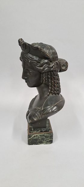 null Bust of a woman draped and coiffed in the antique style in bronze with brown...
