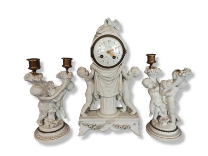 null Mantelpiece including a pair of candlesticks with two lights featuring two putti...