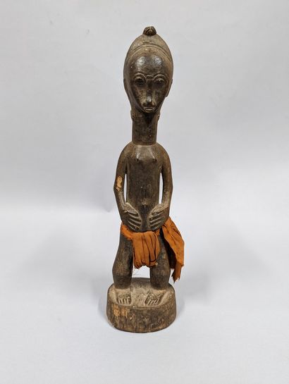 null Ivory Coast
Baule statuette represented with hands on the belly, cloth loincloth....