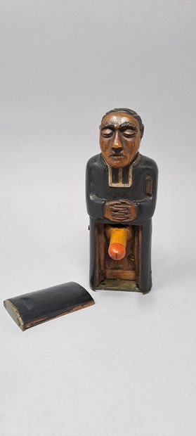 null CURIOSA
Lecherous priest, in polychrome wood and brass base. A slide in his...