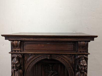 null Cabinet in credenza in walnut and resinous wood, opening with a carved ventaux...
