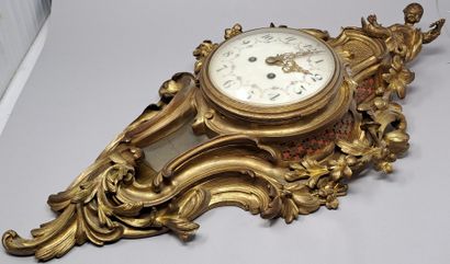 null Gilt bronze wall clock of rocaille form with a Chinese child in the round holding...