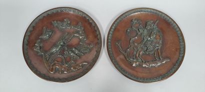 null Set of two round bronze dishes with brown patina and central decoration in relief...