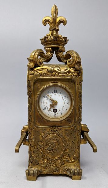 null Bronze clock featuring a sedan chair, indexes black Arabic numbers for the hours...