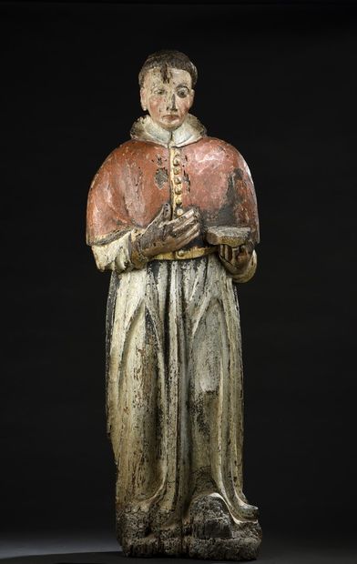 null Religious saint in carved wood, polychromed and gilded. The juvenile face, dressed...