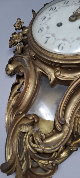null Gilt bronze wall clock of rocaille form with a Chinese child in the round holding...