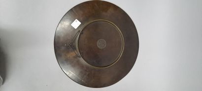 null Set of two round bronze dishes with brown patina and central decoration in relief...