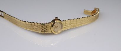 null Ladies' watch, round case in 18k (750) yellow gold, dot and bar indexes on a...